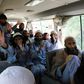 Taliban fighters wave on a bus after being released from prison in Bagram in a handout photograph released Afghanistan's National Security Council