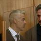 Ernst (R with his lawyer Mustafa Kaplan) said he had carried out a "cowardly and cruel" act
