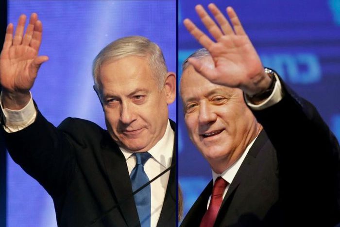 Israeli Prime Minister Benjamin Netanyahu (L) and his former rival Benny Gantz agree on a new coalition government putting an end to Israel's longest political crisis