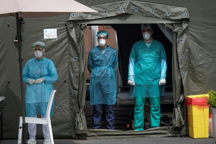 Medical staff at Mohammmed V military hospital wear protective masks and caps as they wait for patients in the Moroccan capital Rabat