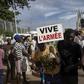 A man holding a sign reading "long live the army" at a rally in Mali's capital Bamako in support of the junta