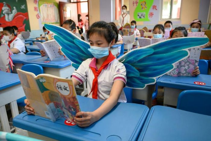 Students are wearing wings to maintain social distancing in Taiyuan in China's northern Shanxi province