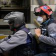 Members of the NGO paramedic group "Angels of the Roads" ride on a motorbike in Caracas, Venezuela