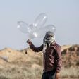 Palestinian militants have been using improvised balloons to carry incendiary materials across the Gaza border into Israel, which imposes a tight blockade on the enclave