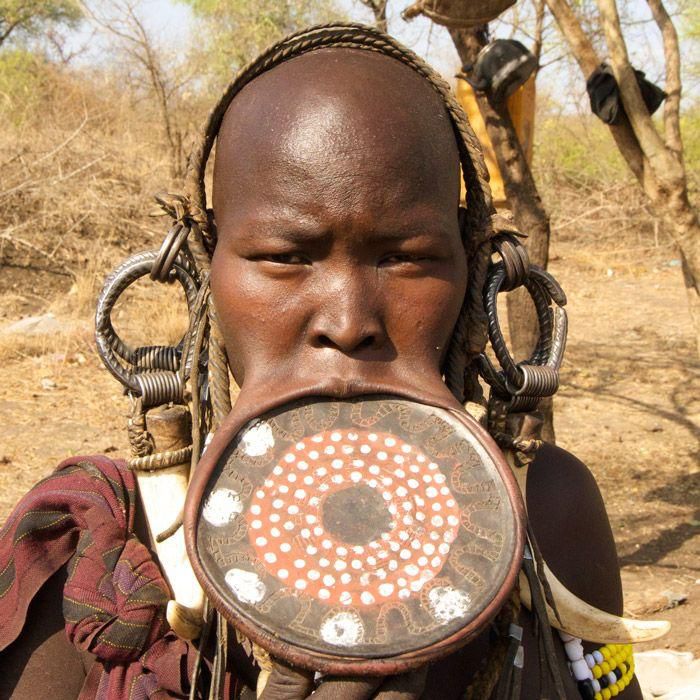 Why girls of the Mursi tribe must remove their teeth and stretch their lips before they marry