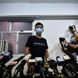 Hong Kong pro-democracy activist Joshua Wong (C) says 'resistance will continue'