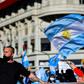 People wave Argentine flags during a protest in Buenos Aires against the government's tight lockdown measures against the spread of the novel COVID-19 coronavirus