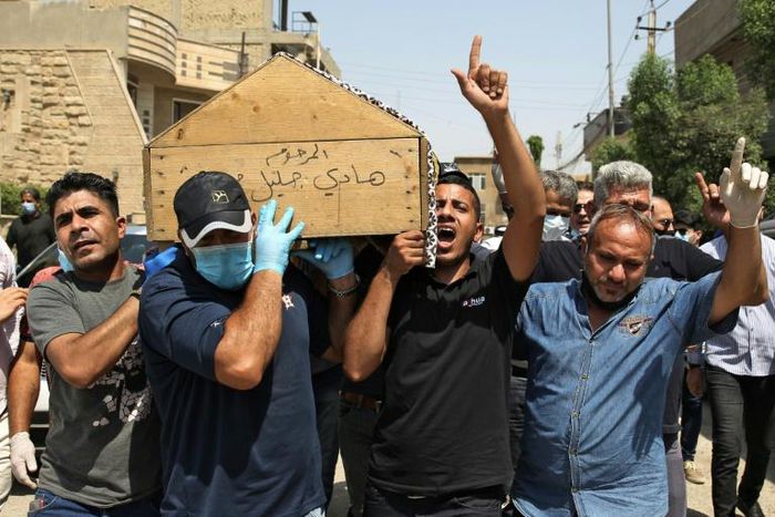 Mourners carry the coffin of Iraqi jihadism expert Hisham al-Hashemi, who was shot dead outside his house in the Iraqi capital