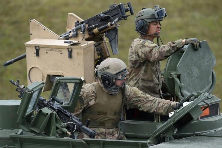 The move will cut the current US troop level in Germany from about 34,500 to 25,000, President Donald Trump's stated goal (US troops pictured near Grafenwoehr, Germany in 2017)