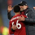 Liverpool manager Jurgen Klopp embraces Reds defender Trent Alexander-Arnold