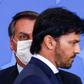 (FILES) In this file photo taken on June 17, 2020 Brazilian President Jair Bolsonaro (L) looks at his newly appointed communications minister, Fabio Faria, at the presidential office in Brasilia.Bolsonaro, backed by his new communications ministry, is ...