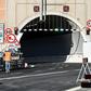 A worker walks near a tunnel before the opening of the new San Giorgio bridge for vehicles