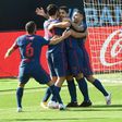 Luis Suarez (C) celebrates after scoring against Celta Vigo on Saturday.