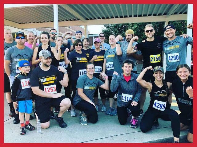 New Horizon Athletics coaches Amanda Wood (first row, second from right) and Adam Wood (Back row, far right) gather with box members after completing a 5K before social-distancing took effect.