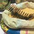 The recovered live rounds of ammunition were carefully concealed inside a half bag of rice [Channels TV]