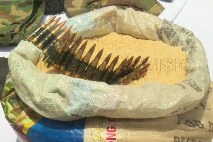 The recovered live rounds of ammunition were carefully concealed inside a half bag of rice [Channels TV]