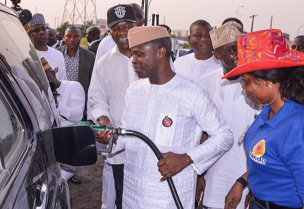 Osinbajo helping out a petrol attendant at an Oando filling station in Lagos