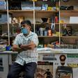 In a store that sells bicycle spare parts, the Shah brothers are feeling the impact of the pandemic on the economy