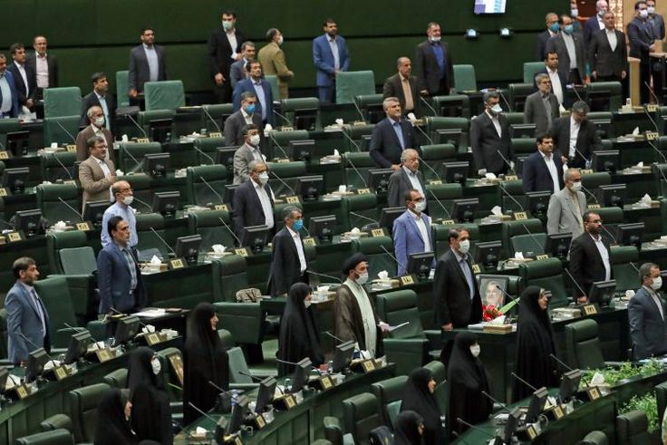 For the opening session of Iran's new parliament, a seat was left vacant between each lawmaker in accordance with social distancing guidelines although few wore masks against the coronavirus