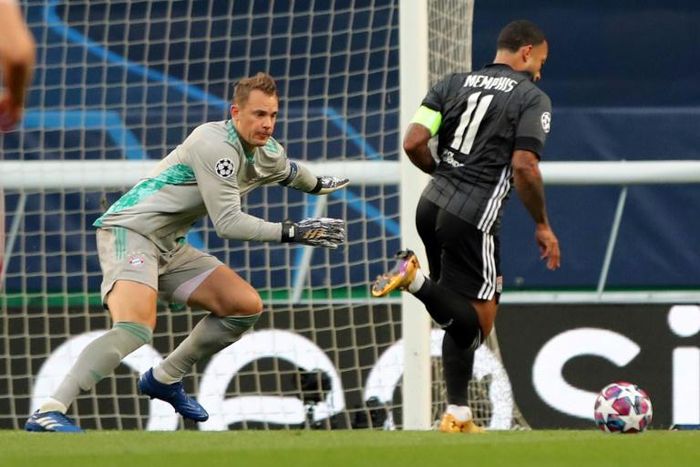Bayern Munich goalkeeper Manuel Neuer faces Lyon forward Memphis Depay in the Germans' 3-0 win