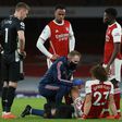 Arsenal defender David Luiz receives medical treatment at the Emirates Stadium