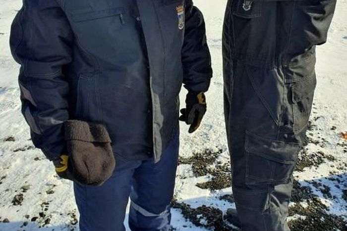 A Chilean Air Force doctor checking the temperature of personnel at the Eduardo Frei Antarctic base on the Fildes Peninsula, on May 10, 2020