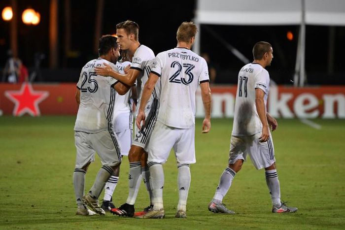 Philadelphia Union players celebrate a victory that clinched a berth in the knockout stage of the MLS is Back Tournament while the league can celebrate no new COVID-19 positives in Monday and Tuesday testing at the bubble in Orlando, Florida