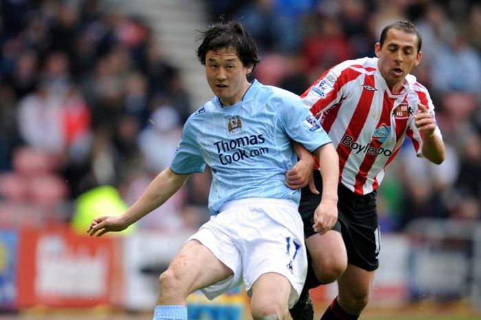 Sun Jihai (left) playing for Manchester City in 2008