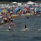 Despite COVID-19 fears, people enjoy warm summer weather at a beach near the Baltic Sea village of Binz, northern Germany