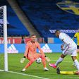 France's forward Kylian Mbappe (C) scores the opening goal past Sweden's goalkeeper Robin Olsen (L) during the UEFA Nations League football match between Sweden and France on September 5, 2020 at the Friends Arena in Solna, near Stockholm.