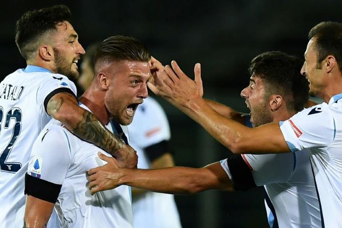 Lazio's Serbian midfielder Sergej Milinkovic-Savic (2ndL) celebrates after scoring against Atalanta in Bergamo.