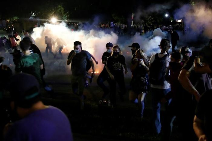 Police in the Wisconsin city of Kenosha used tear gas on August 25, 2020 in a bid to break up a demonstration sparked by the police shooting of Jacob Blake, a black man, as his three children watched