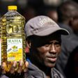 Inflation anger: A protester holds a bottle of cooking oil during a demonstration in Harare last August over the cost of food