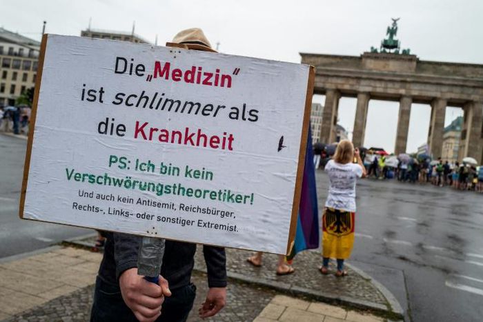 Protesters claiming that 'the cure is worse than the disease'