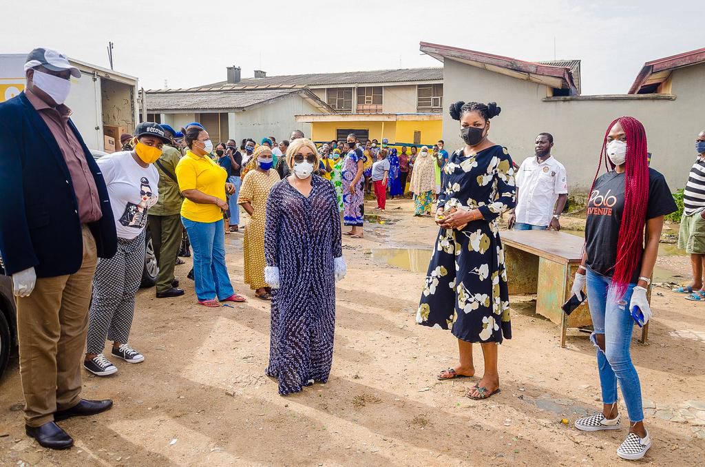 Police College Ikeja - Caption: Executive Director, Polo Luxury Group, Jennifer Obayuwana (Center) during the Organizations' Covid-19 relief outreach at the Police College in Ikeja.