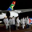 Cuban medial workers at the Waterkloof Air Force Base in Pretoria on April 27, 2020 to support coronavirus efforts in a photo released by the South African government