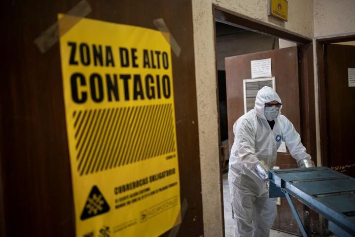An employee wears protective gear while working at the Azcapotzalco crematorium  in Mexico City, on August 6, 2020, amid the COVID-19 coronavirus pandemic