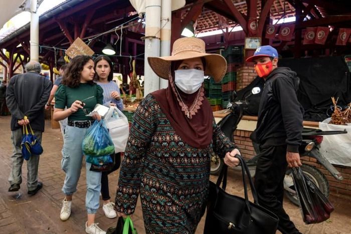 Shoppers browse through the central market in Tunis during the fasting month of Ramadan