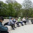Teacher Marie Kaas-Larsen speaks with her pupils of the Norrebro Park primary school outside in a nearby park in Copenhagen, Denmark