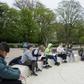 Teacher Marie Kaas-Larsen speaks with her pupils of the Norrebro Park primary school outside in a nearby park in Copenhagen, Denmark