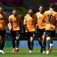 Happy pack of Wolves: Diogo Jota (right)celebrates after scoring Wolves' third goal in a 3-0 win over Everton