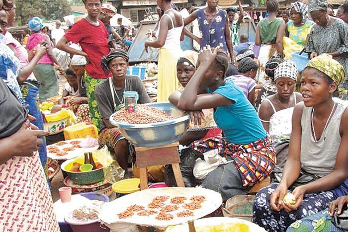 Petty traders selling food items in one of the markets in Lagos