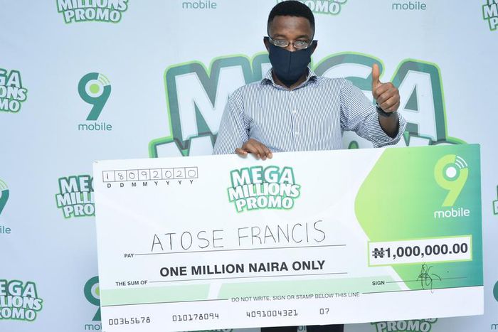 Atose Francis, N1million winner, giving the 9mobile brand a thumb up at the ongoing 9mobile Mega Millions Promo prize presentation in Ibadan.