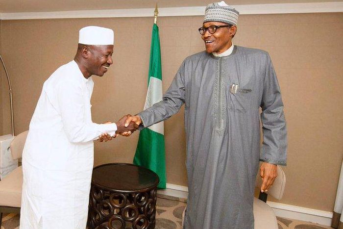 Ibrahim Magu (left) shakes hands with President Muhammadu Buhari (right) [EFCC]