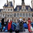 Tents belonging to those living on the streets are a rare sight outside Paris' opulent town hall