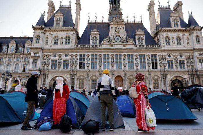 Tents belonging to those living on the streets are a rare sight outside Paris' opulent town hall