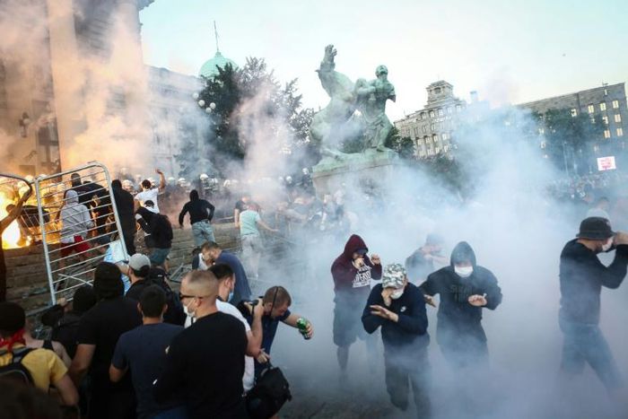 Clouds of tear gas and smoke filled central Belgrade after a peaceful gathering descended into tense confrontations between protesters and police