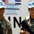 Peacekeepers from Honduras, Maria Sandra Granados (left) and Carme Lara, are photographed on a training mission in Talanga, Honduras on July 29, 2008 before deploying to Haiti