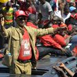 Cellou Dalein Diallo waves to the crowd at a protest against the third term of President Alpha Conde