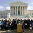 Norma McCorvey (C-Podium), the Roe of Roe v. Wade, speaks on the steps of the US Supreme Court on January 18, 2005 after petitioning the court to reverse its landmark decision that granted women the right to an abortion